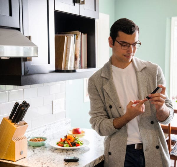 man checking blood sugar diabetes and eye diseaseblog post