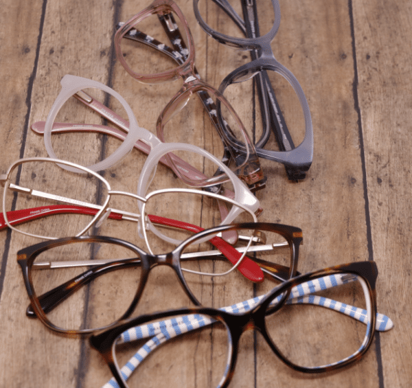 multiple pairs of prescription glasses in a row